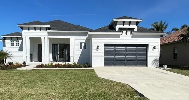 14118 Fort Myers Ave, Port Charlotte — Luxury Florida home front elevation
