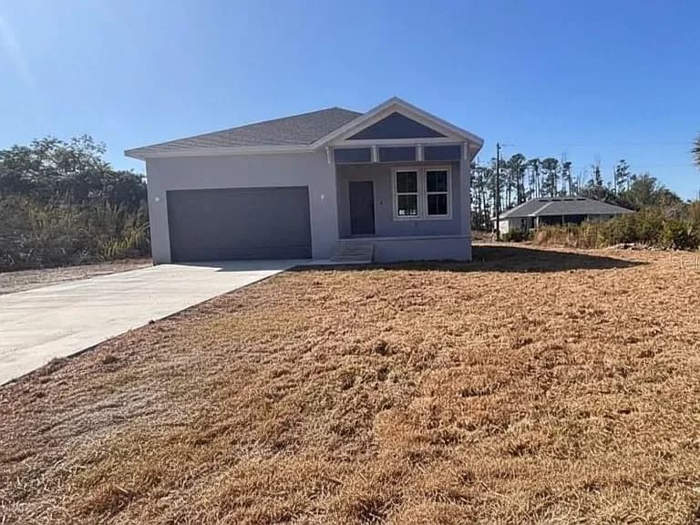 309 Lakewood Ln, Port Charlotte — Backyard patio with outdoor seating