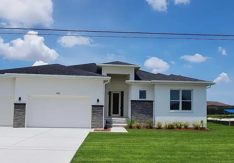 9231 Key West St, Port Charlotte — Featured custom home with landscaped front yard